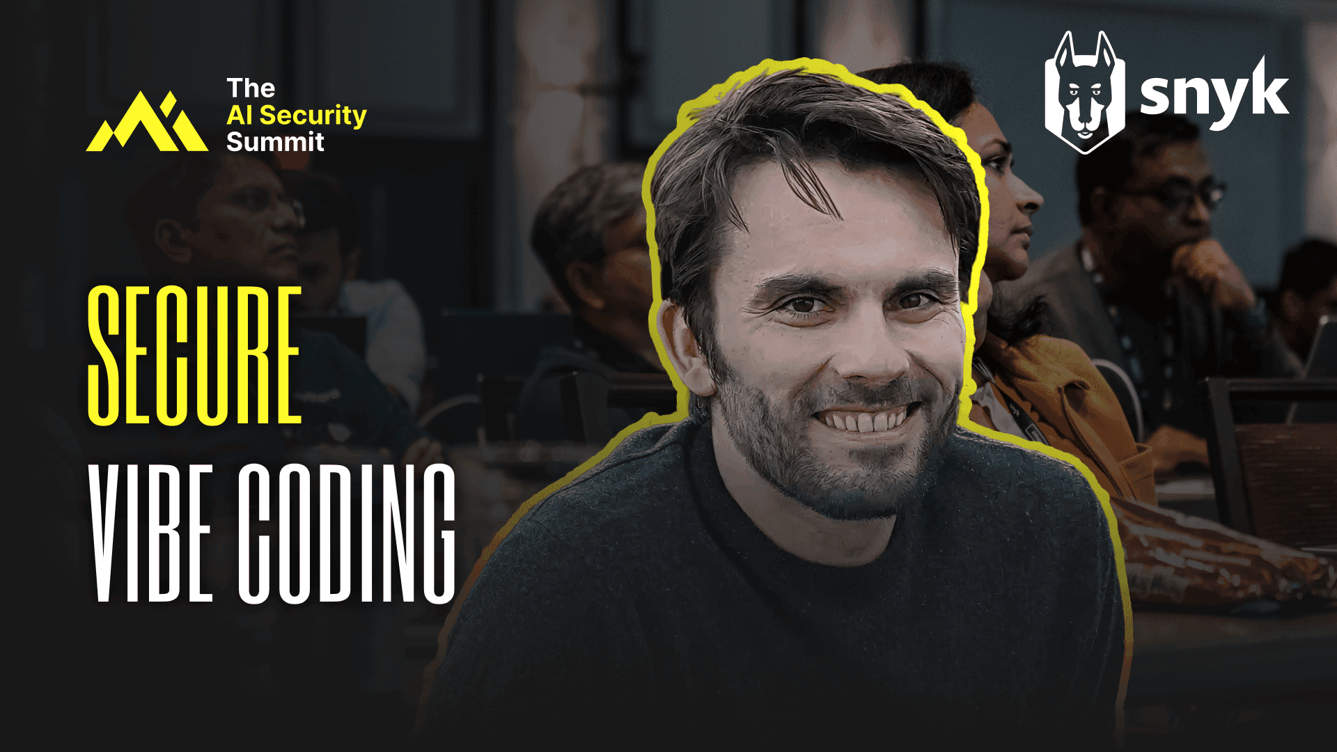 Speaker Andrew Oates from Snyk standing on stage at the AI Security Summit, with text overlay 'Secure Vibe Coding'